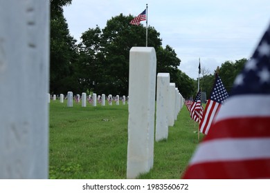 Kerrville, Texas - May 31st 2021: A Row Of Gravestones On The Kerrville Nation Cemetery With Small American Flags In Front Of Each Of Them.