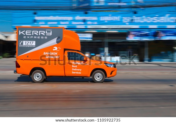 The\
Kerry express logistic truck running on street for send box to\
customer on June,05,2018 at Bangkradi Road,Bangkok,thailand.       \
                                                  \
