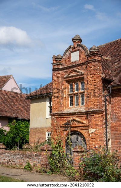 KERSEY, SUFFORL, UK - CIRCA 2021 SEPT: An\
attractive old red brick property built in 1490 in rural Kerasey\
now lies in need of serious\
repairs