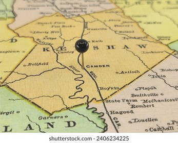 Kershaw County, South Carolina marked by a black tack on a colorful vintage map. The county seat is located in the city of Camden, SC.