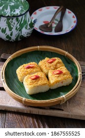 Ketan Bumbu is a traditional snack from Betawi, Jakarta, Indonesia made from sticky rice topped with grated coconut seasoned slightly spicy according to taste. Selective focus