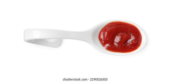 Ketchup In Ceramic Serving Spoon Isolated On White, Top View