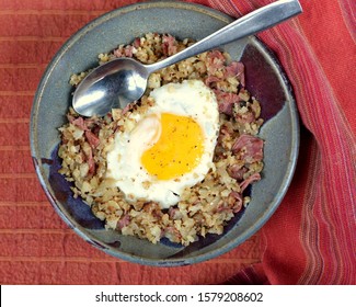 Keto Breakfast Bowl; Cauliflower And Corned Beef Hash, Topped With Fried Egg