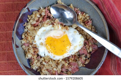 Keto Breakfast Bowl; Cauliflower And Corned Beef Hash, Topped With Fried Egg