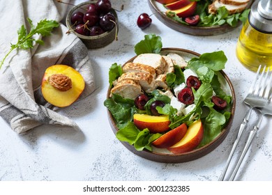 Keto Diet Lunch. Healthy Diet Salad With Arugula, Grilled Turkey, Peach, Cherry, Feta And Vinaigrette Dressing On A Stone Tabletop. 