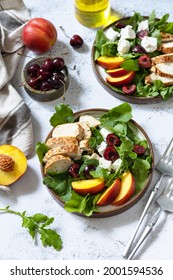 Keto Diet Lunch. Healthy Diet Salad With Arugula, Spinach, Grilled Turkey, Peach, Cherry, Feta And Vinaigrette Dressing On A Stone Tabletop. 