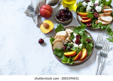 Keto Diet Lunch. Healthy Diet Salad With Arugula, Grilled Turkey, Peach, Cherry, Feta And Vinaigrette Dressing On A Stone Tabletop. Copy Space.