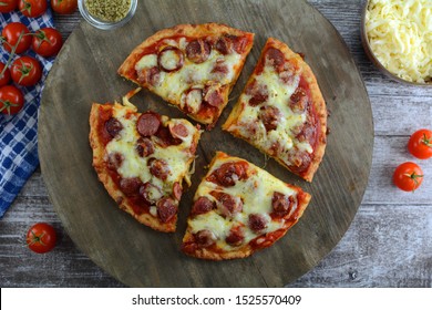 Keto Fathead Pizza With Mozzarella Crust And Pepperoni And Cheese Topping- A Set Of Photos Showing The Recipe Ingredients, Method And The Final Dish