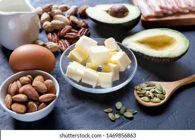 Keto food: avocado, bacon, nuts, eggs, etc. Healthy fats concept.