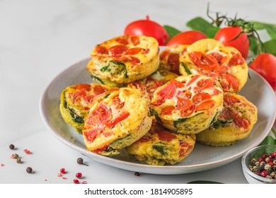 Keto Or Low Carb Diet Breakfast. Egg Muffin Cups Or Omelet With Spinach And Tomatoes In A Plate On White Background. Close Up