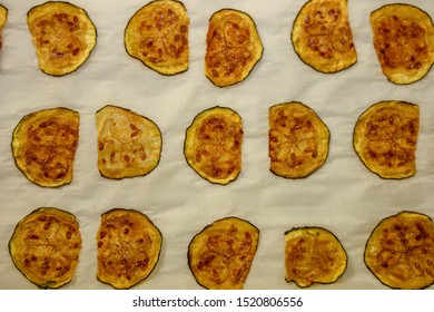 Keto Zucchini Chips Resting On Baking Sheet After Being Baked In The Oven.