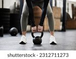 Kettle bell, fitness and woman in gym for weightlifting, bodybuilder training and strong muscles. Healthy body, weights and hands of female person in sport center for wellness, exercise and workout