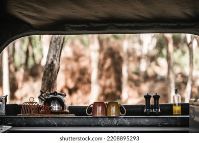 Kettle Salt Pepper Glass Container With Oil Refrigerator And Kitchen Utensils Clean And Tidy Inside A Camping Tent, Tarawera Lake, New Zealand