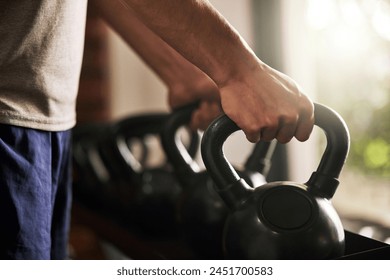 Kettlebell, hands and training in gym, fitness and hard work for body builder, strong and muscle of forearm. Workout, exercise and athlete in club, wellness and balance in sports, person with goal - Powered by Shutterstock