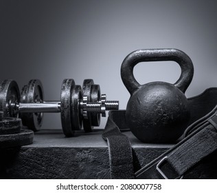 Kettlebell and sports dumbbells for training in the gym. The photograph is monochrome. - Powered by Shutterstock