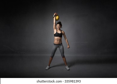 Kettlebell Training For A Girl, Dark Background