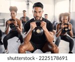 Kettlebell, workout and fitness class with a gym coach and people training with cardio and exercise. Portrait of a strong personal trainer and sports friends in a wellness health club with motivation