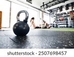 Kettlebells on floor in gym. Gym equipment for strength training.