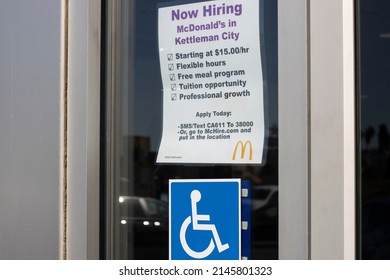 Kettleman City, CA, USA - Mar 20, 2022: Now Hiring Advertisement With A List Of Promises Is Seen At The Entrance To A McDonald's Restaurant In Kettleman City, California, As Labor Shortage Persists.