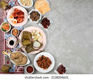 Ketupat Lebaran Ied Menu Dish, Opor Ayam, Sambal Goreng Ati Kentang, Balado Telur, Dates Fruit, Sambal, and Tea. Top View with Copy Space 