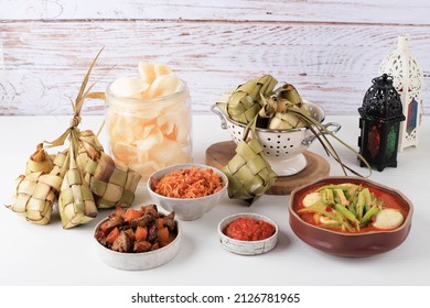 Ketupat Lebaran Set, Full Package Menu Served during Lebaran Eid, on the Table White Background.  - Shutterstock ID 2126781965