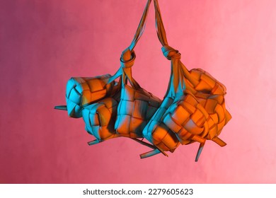  Ketupat (Rice Dumplings) With blue and orange background. Ketupat is a natural rice shell made from young coconut leaves to cook rice during Eid. selective focus - Shutterstock ID 2279605623