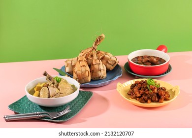 Ketupat Sayur typical Lebaran, served with Opor Ayam, Semur Telur Puyuh, and Sambal Goreng Ati Kentang. Special dishes during Eid al-Fitr and Eid al-Adha, especially in Indonesia.  - Shutterstock ID 2132120707