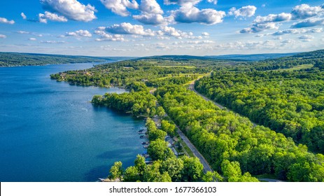 Keuka Lake Surrounded By Green Trees During The Summertime. 