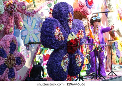 KEUKENHOF, NETHERLANDS - MAY 03, 2014: Flower Parade. Figures And Compositions From Flowers. Tulips And Clogs Made From Flowers. National Dutch Flower Parade. Peace Symbols.