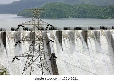 Kevadia ,11, September ,2010 : Close Up Of Electric Transmission Tower Supplying Hydro Power With Overflowing River Waters In Background  From Sardar Sarovar Dam At Kevadia, Gujarat, India, Asia