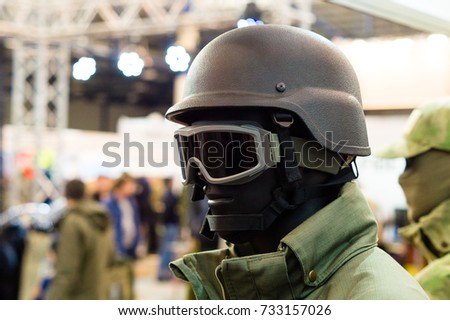 Kevlar helmet. Tactical helmet and glasses. SWAT equipment. Military protection. 