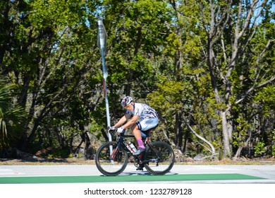 KEY BISCAYNE, FL, USA - APRIL 17, 2018: Man is cycling on Virginia Key island located near Miami, Florida