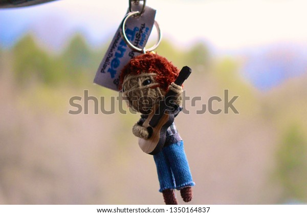 Key
chain hanging from mirror driving through
Vermont.