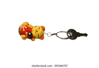 Key Chain In Shape Kitten Lucky Doll Isolated On A White Background.