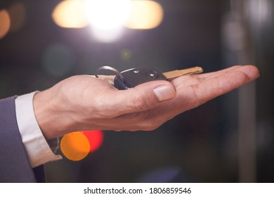 Key Deposit Service  Man's Hand Waiting To Pick Up The Car Keys