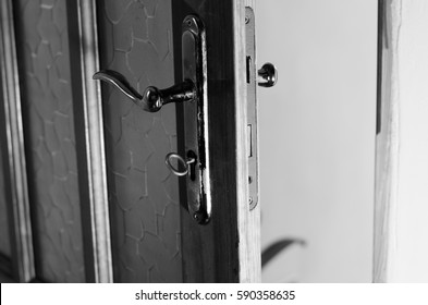 key in the door lock - Shutterstock ID 590358635