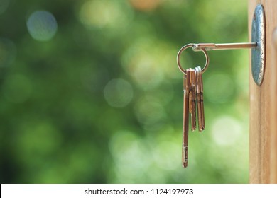 Key in door lock with blurry background, 