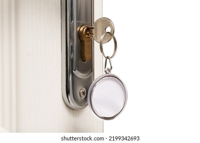 Key With Fob In Door Lock, Closeup. Space For Text