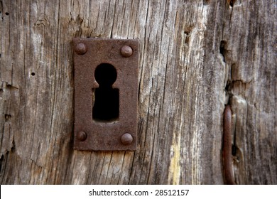 Key Hole Over Aged Gray Old Wood, Rusty Metal