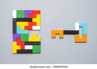 Key and keyhole shape of geometric colorful wood puzzle pieces. logical thinking, business logic, Conundrum, decision, solutions, rational, mission, success, goals and strategy concepts - Shutterstock ID 1908399244
