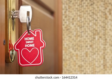 key with label home 
