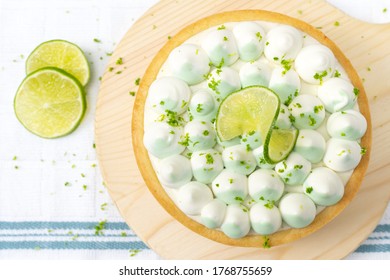 Key Lime Cheese Tart With Whipping Cream On The Table, Horizontal View From Above