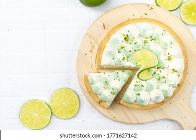 Key Lime Cheese Tart With Whipping Cream On The Table, Horizontal View From Above