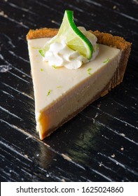 
Key Lime Pie. Classic Traditional American Dessert Favorite. Key Lime Pie, Raw Mixture Made With The Juice From Key West Lime Juice, Condensed Milk Sugar And Eggs Poured Into Graham Cracker Crust. 