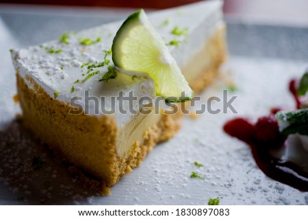 
Key Lime Pie. Classic traditional American dessert favorite. Key lime pie, raw mixture made with the juice from Key West lime juice, condensed milk sugar and eggs poured into graham cracker crust. 