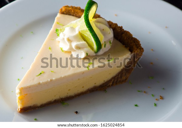 \
Key Lime Pie. Classic traditional American dessert\
favorite. Key lime pie, raw mixture made with the juice from Key\
West lime juice, condensed milk sugar and eggs poured into graham\
cracker crust. 