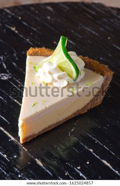 
Key Lime Pie. Classic traditional American dessert
favorite. Key lime pie, raw mixture made with the juice from Key
West lime juice, condensed milk sugar and eggs poured into graham
cracker crust. 