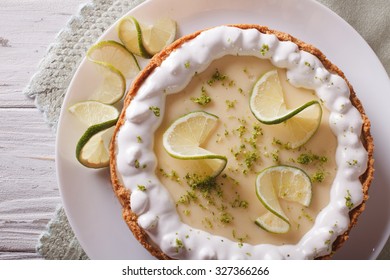 Key Lime Pie With Whipped Cream Close-up On A Plate. Horizontal View From Above
