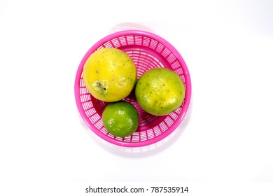 Key Lime In Plastic Bucket On White Background