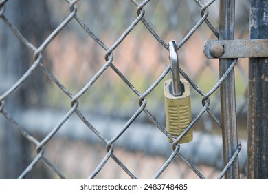 Key Lock Attached to a Chain Link Fence with Selective Focus